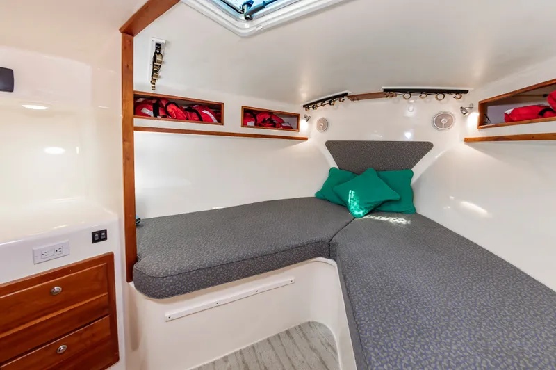 Carry On Yacht Photos Pics Interior of 2003 Custom Carolina Layton Express with cozy bed.