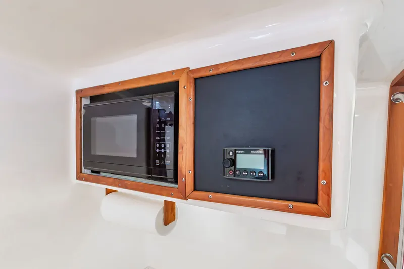 Carry On Yacht Photos Pics Microwave and control panel in 2003 Custom Carolina Layton Express.