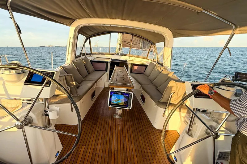  Yacht Photos Pics Luxurious 2013 Beneteau Oceanis 58 yacht interior with dual steering wheels and spacious seating.