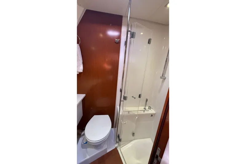  Yacht Photos Pics Bathroom interior of 2013 Beneteau Oceanis 58 yacht with shower and toilet.