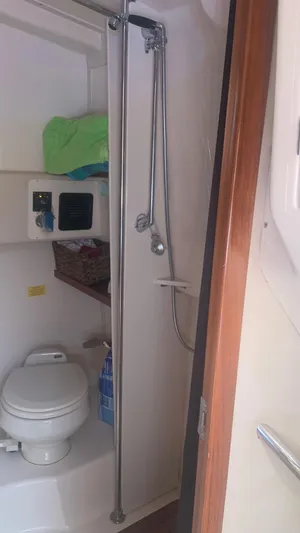  Yacht Photos Pics 2006 Grady-White 360 Express boat bathroom with shower and toilet.