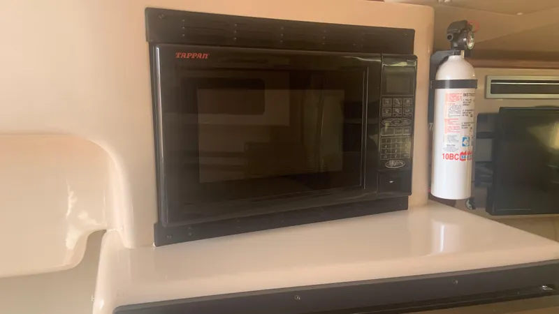  Yacht Photos Pics Microwave in 2006 Grady-White 360 Express boat interior kitchen area.