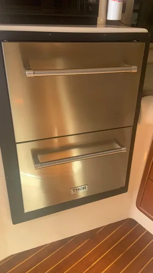  Yacht Photos Pics Stainless steel drawers on 2006 Grady-White 360 Express boat interior.