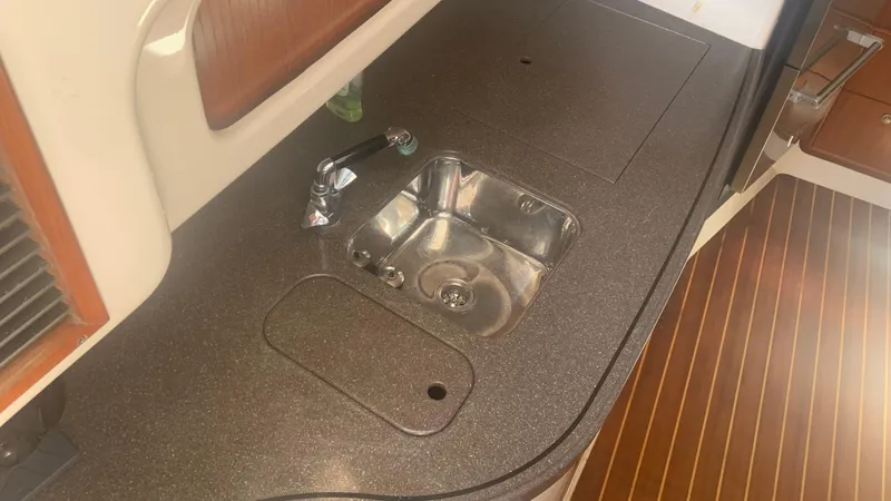  Yacht Photos Pics 2006 Grady-White 360 Express boat interior with sink and countertop.