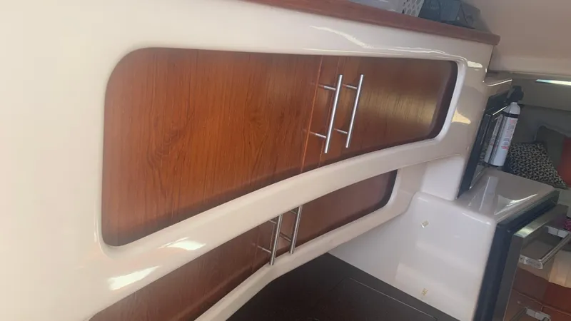  Yacht Photos Pics 2006 Grady-White 360 Express interior with wooden cabinets and modern design.