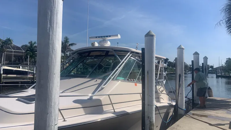  Yacht Photos Pics 2006 Grady-White 360 Express boat docked at marina under clear blue sky.