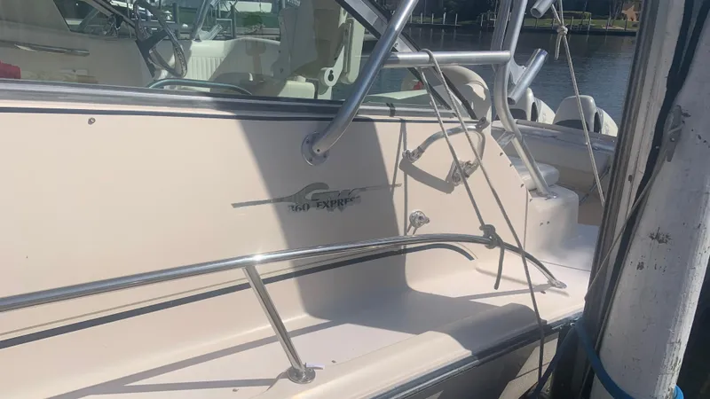  Yacht Photos Pics 2006 Grady-White 360 Express boat docked, featuring sleek design and sturdy railings.