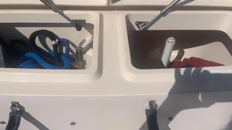  Yacht Photos Pics Storage compartments on a 2006 Grady-White 360 Express boat with ropes and equipment.