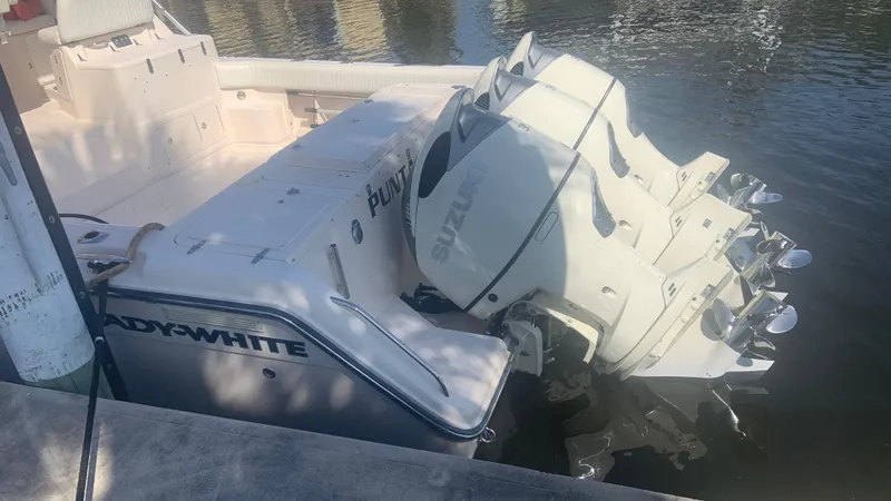  Yacht Photos Pics 2006 Grady-White 360 Express boat with dual Suzuki outboard engines docked in water.