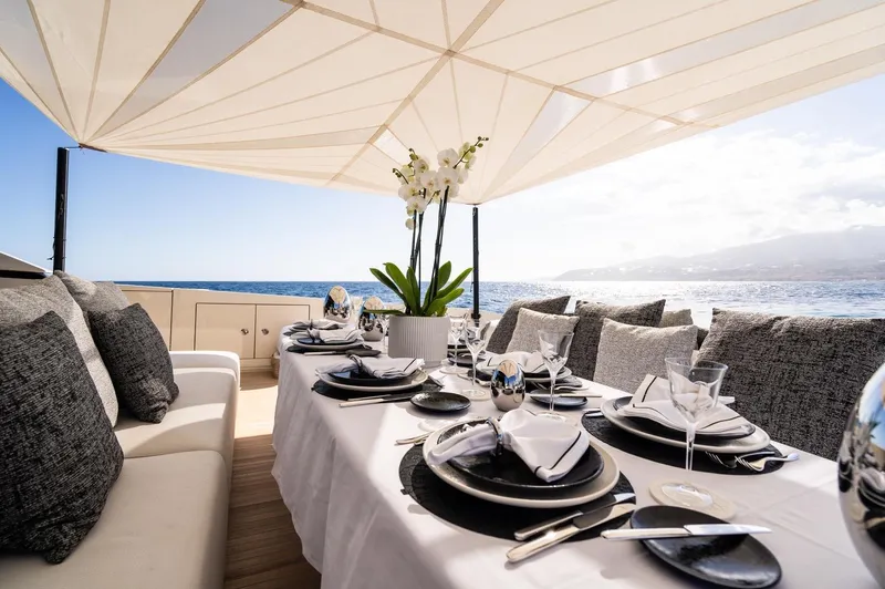 Anmax Yacht Photos Pics Luxurious dining setup on 2022 Sanlorenzo SP110 yacht with ocean view.