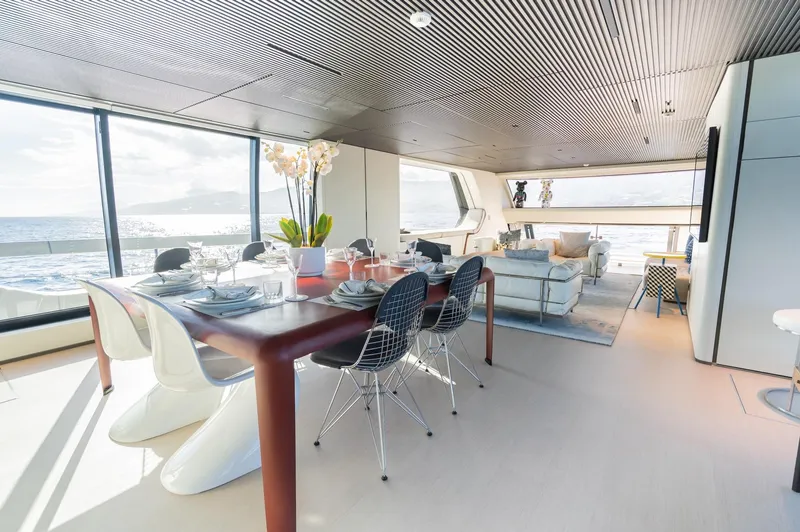 Anmax Yacht Photos Pics Luxurious interior of 2022 Sanlorenzo SP110 yacht with modern dining and living area.