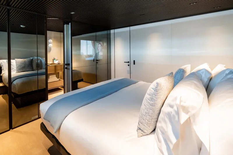 Anmax Yacht Photos Pics Luxurious bedroom interior on 2022 Sanlorenzo SP110 yacht with modern design and elegant decor.