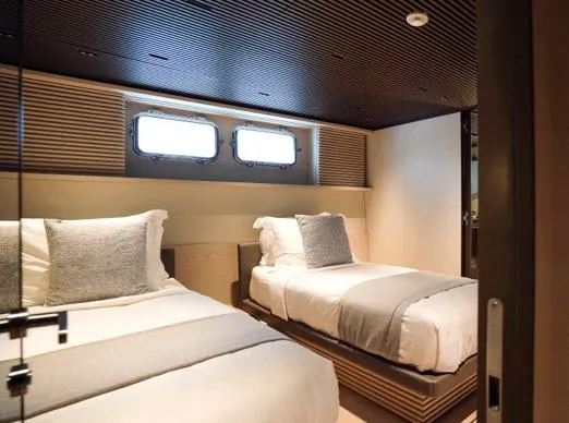 Anmax Yacht Photos Pics Luxurious twin bedroom on 2022 Sanlorenzo SP110 yacht, featuring modern design and cozy ambiance.
