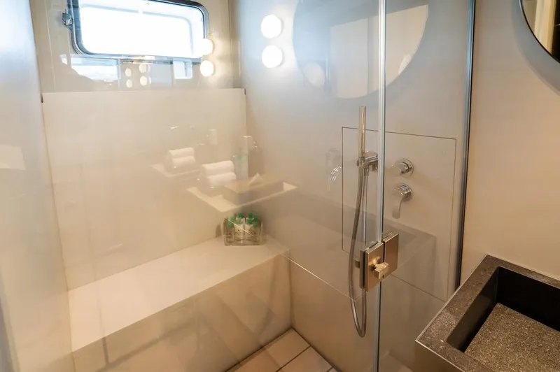 Anmax Yacht Photos Pics Luxurious bathroom in 2022 Sanlorenzo SP110 yacht with modern fixtures and glass shower.