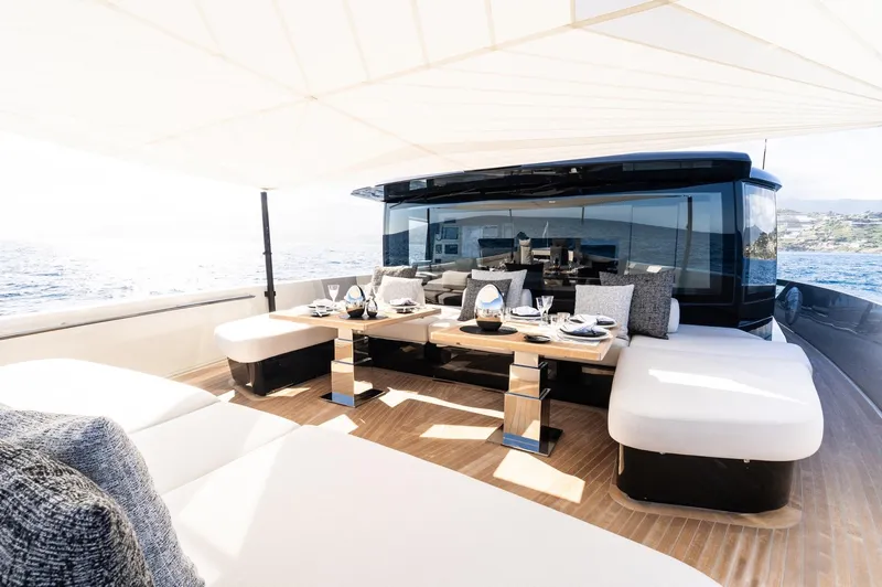 Anmax Yacht Photos Pics Luxurious Sanlorenzo SP110 yacht deck with elegant dining setup, 2022 model.