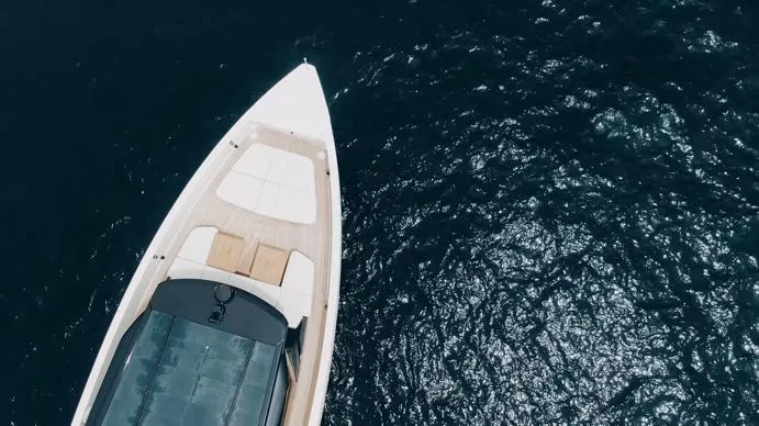 Anmax Yacht Photos Pics Aerial view of 2022 Sanlorenzo SP110 yacht on shimmering water.