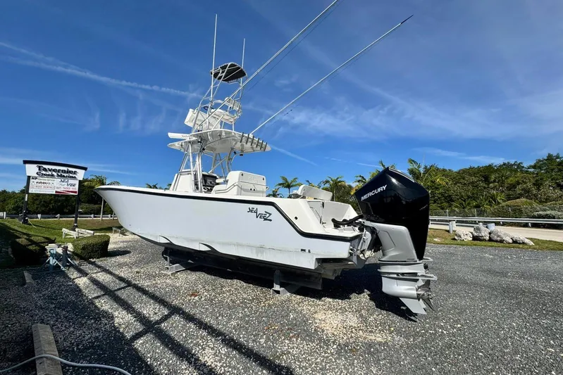  Yacht Photos Pics 2022 SeaVee 340Z boat with Mercury engine displayed at marina under clear blue sky.