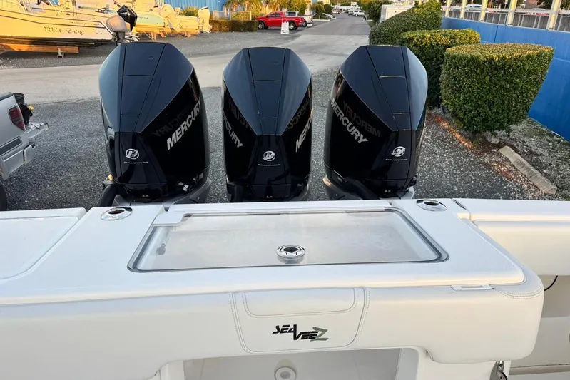  Yacht Photos Pics 2022 SeaVee 340Z boat with triple Mercury engines, docked in a marina.
