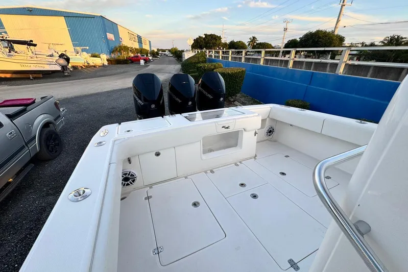  Yacht Photos Pics 2022 SeaVee 340Z boat with triple Mercury engines, docked in a marina setting.