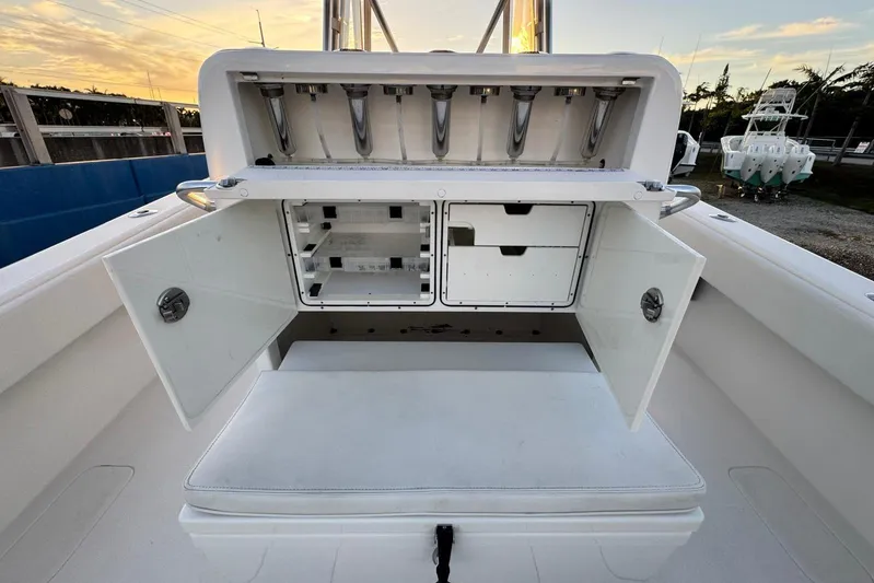  Yacht Photos Pics 2022 SeaVee 340Z boat storage compartment with open doors at sunset.