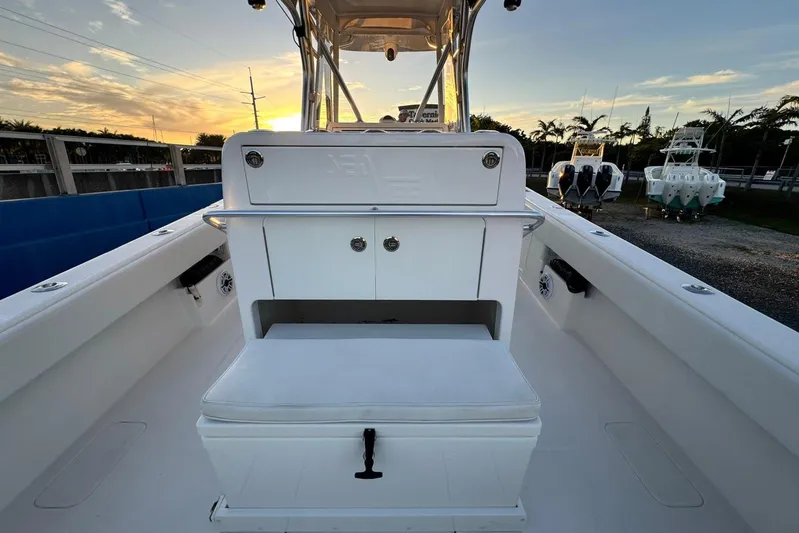  Yacht Photos Pics 2022 SeaVee 340Z boat interior with seating and storage, sunset view.