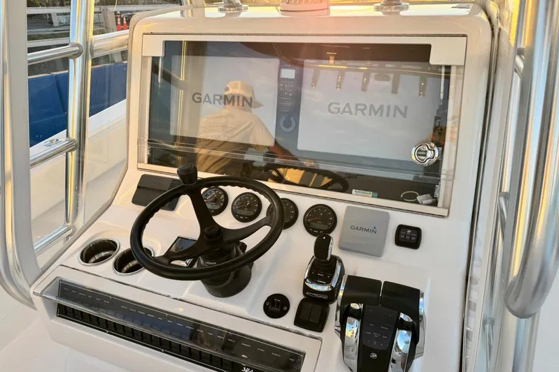  Yacht Photos Pics 2022 SeaVee 340Z boat dashboard with Garmin navigation system and steering wheel.