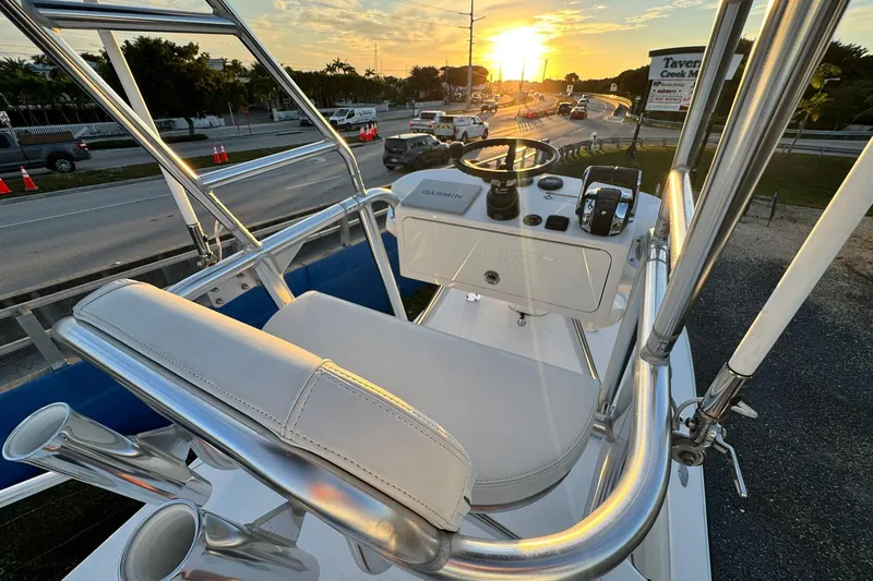  Yacht Photos Pics 2022 SeaVee 340Z boat helm with sunset view, featuring sleek design and modern controls.