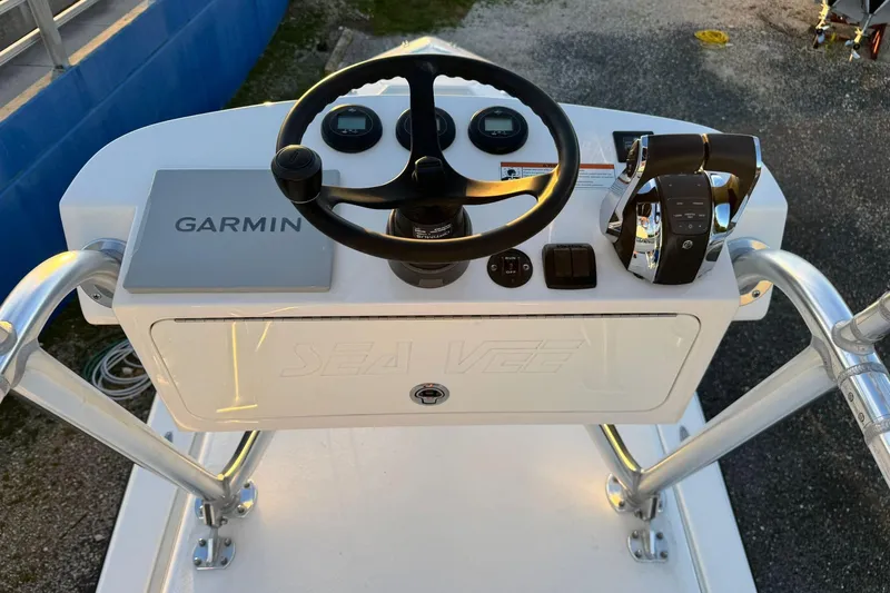 Yacht Photos Pics 2022 SeaVee 340Z boat console with Garmin navigation and steering wheel.