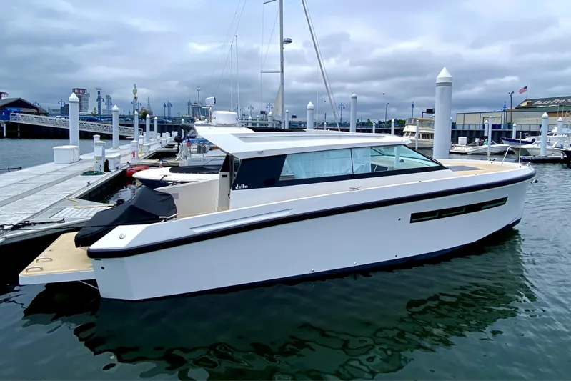  Yacht Photos Pics 2023 Delta Powerboats 33 Coupe docked at marina, sleek design, modern features.