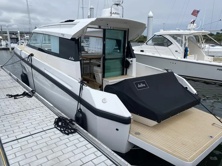  Yacht Photos Pics 2023 Delta Powerboats 33 Coupe docked, showcasing sleek design and modern features.