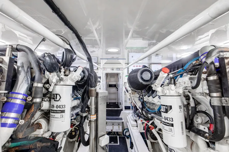 Mobster Yacht Photos Pics Engine room of a 2007 Viking 68 Convertible yacht, showcasing dual CAT engines.