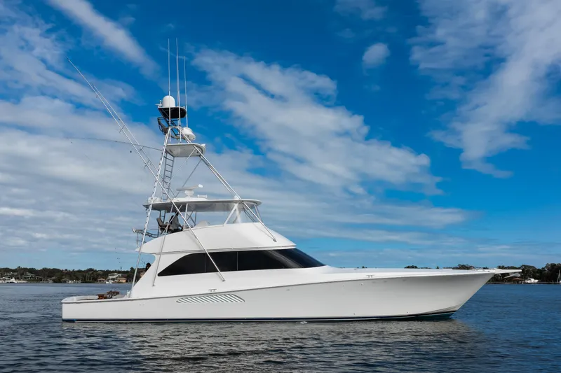 Mobster Yacht Photos Pics 2007 Viking 68 Convertible yacht on calm water under blue sky.
