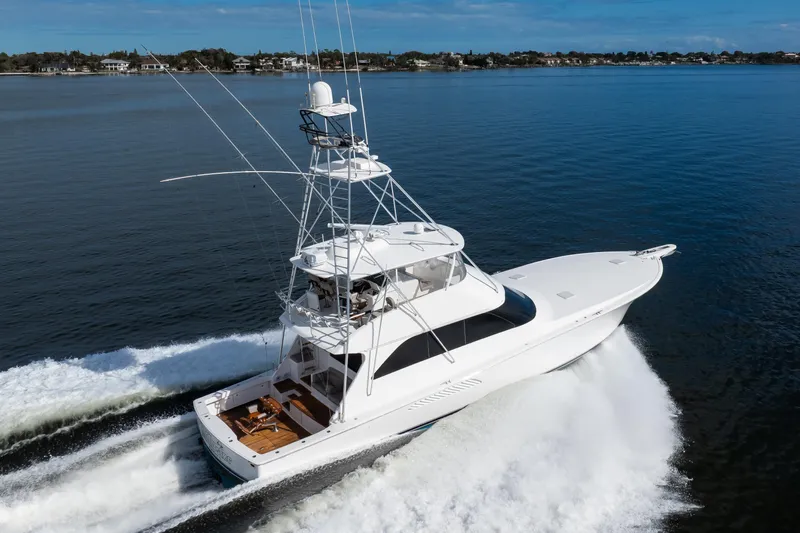 Mobster Yacht Photos Pics 2007 Viking 68 Convertible yacht cruising on open water, showcasing sleek design and performance.