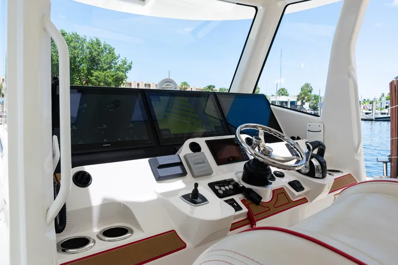  Yacht Photos Pics 2022 SeaVee 450z boat helm with advanced navigation displays and controls.