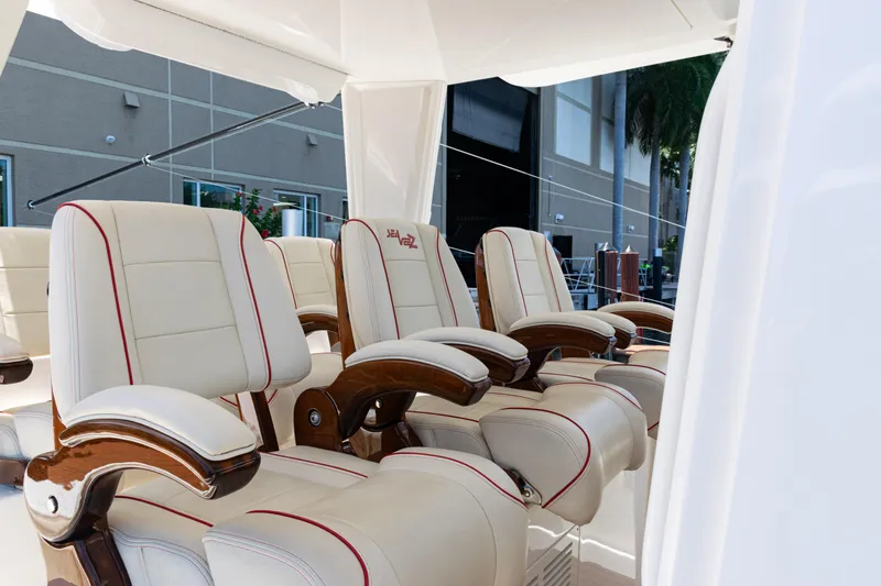  Yacht Photos Pics Luxurious seating on 2022 SeaVee 450z boat, featuring elegant cream and red upholstery.