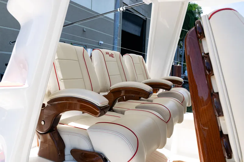  Yacht Photos Pics Luxurious seating on 2022 SeaVee 450z boat with elegant wood accents.