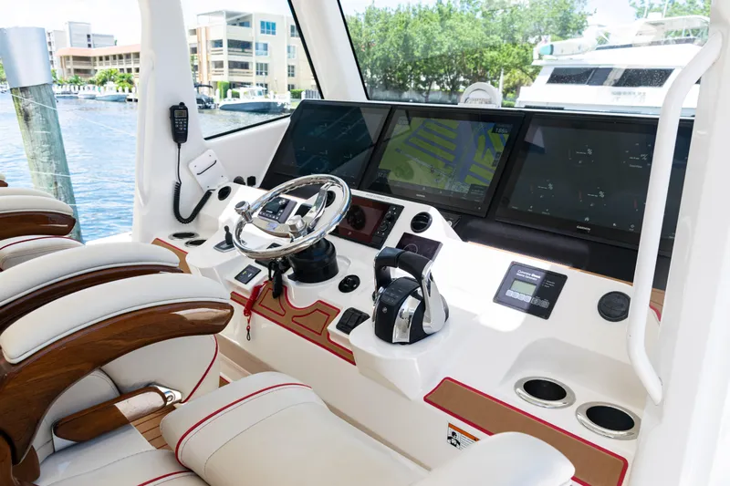  Yacht Photos Pics 2022 SeaVee 450z helm with advanced navigation displays and luxurious seating.