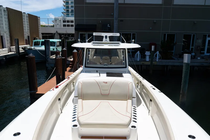  Yacht Photos Pics 2022 SeaVee 450z boat docked, featuring sleek design and comfortable seating.