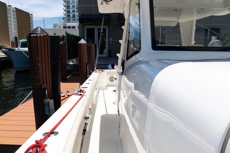  Yacht Photos Pics 2022 SeaVee 450z boat docked, showcasing sleek design and modern features.