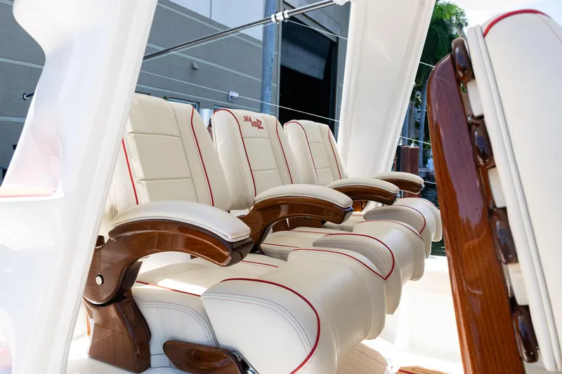 Yacht Photos Pics Luxurious seating on 2022 SeaVee 450z boat with elegant wood accents.