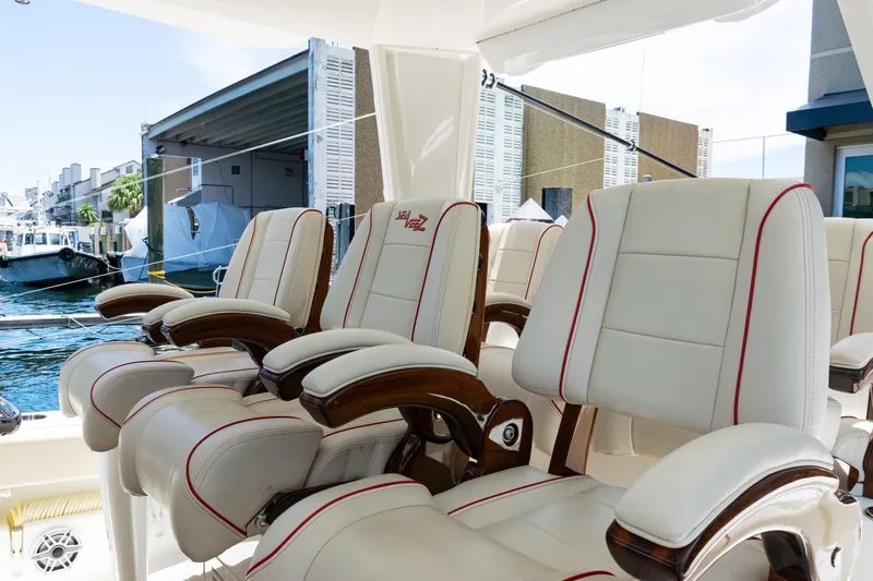  Yacht Photos Pics Luxurious seating on 2022 SeaVee 450z boat, featuring elegant white and red upholstery.