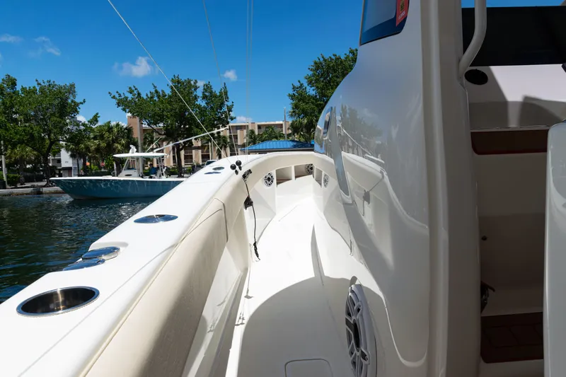  Yacht Photos Pics 2022 SeaVee 450z boat deck with sleek design, docked near waterfront.