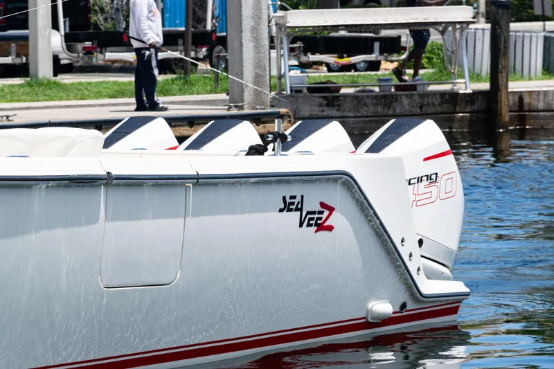 Yacht Photos Pics 2022 SeaVee 450z boat docked, featuring powerful engines and sleek design.