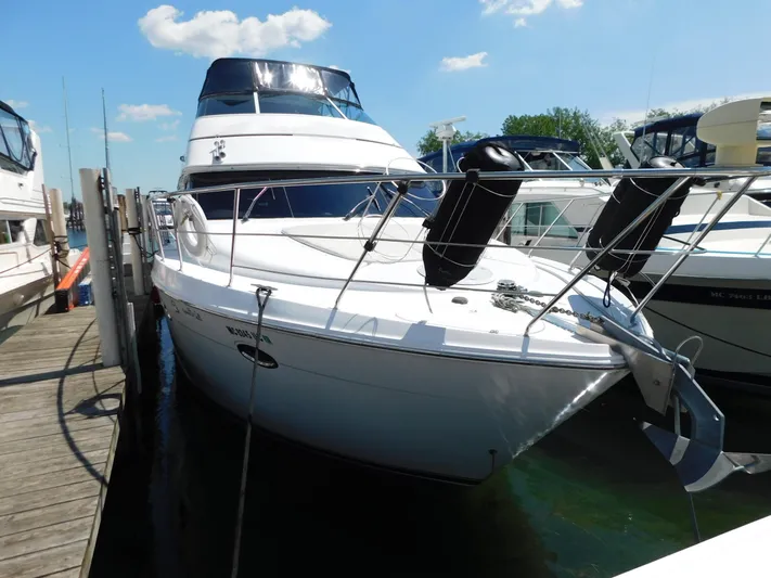  Yacht Photos Pics 2002 Carver 450 Voyager Pilothouse yacht docked at marina under clear sky.