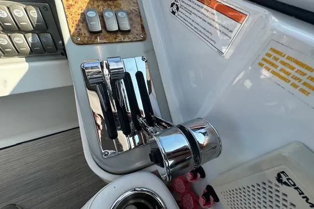  Yacht Photos Pics Throttle controls on a 2008 Formula 330 Sun Sport boat dashboard.