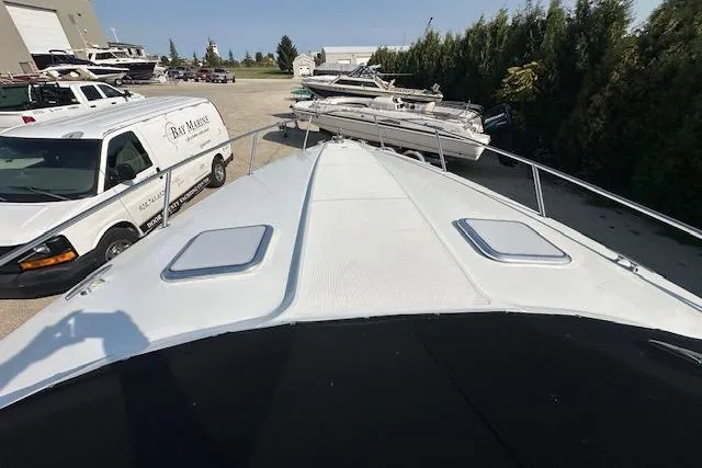  Yacht Photos Pics 2008 Formula 330 Sun Sport boat on display near a marine service van.