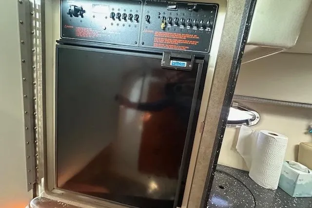  Yacht Photos Pics 2008 Formula 330 Sun Sport cabin interior with control panel and kitchenette.