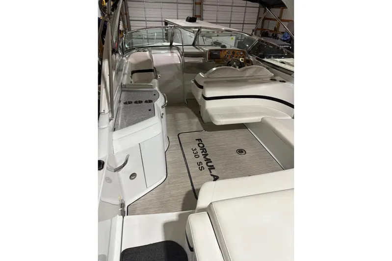  Yacht Photos Pics 2008 Formula 330 Sun Sport boat interior with seating and dashboard.