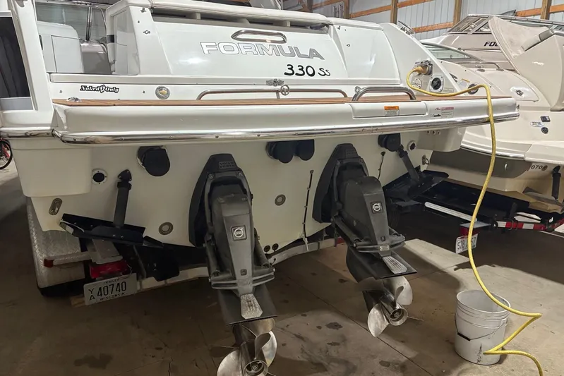  Yacht Photos Pics 2008 Formula 330 Sun Sport boat in storage, showing dual outboard motors.