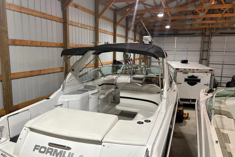  Yacht Photos Pics 2008 Formula 330 Sun Sport boat in a storage facility, featuring a sleek design and spacious interior.